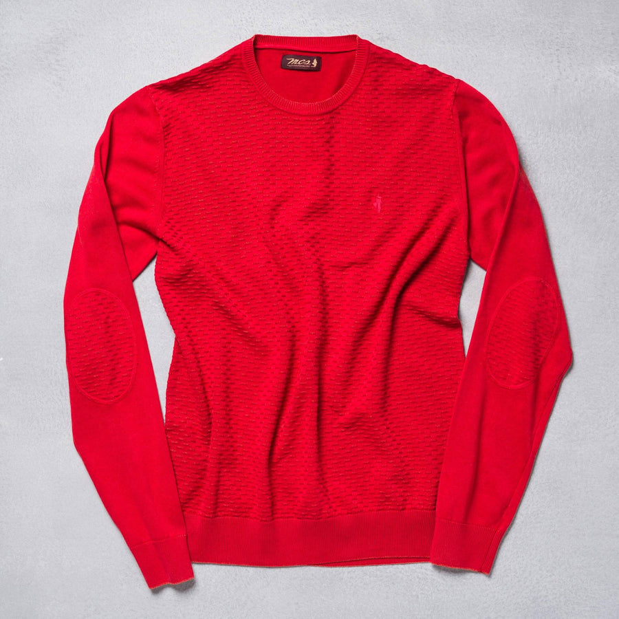 Maglione tinta unita con motivi in rilievo